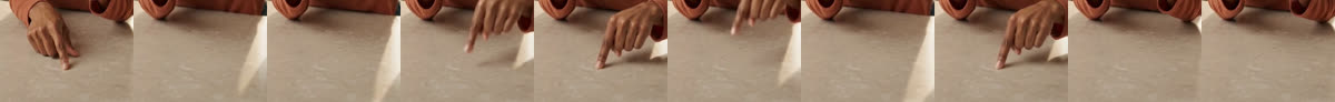 Ten-frame crop of the hand: the finger lifts clear of the counter and presses down